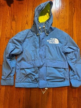The North Face Light Blue Hooded Jacket with Yellow Lining